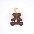 Deep brown leather bear keychain with golden clasp and engraved silver pendant - Brown