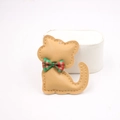 Detail of camel leather cat charm featuring fine stitching and a green plaid bow accessory - Khaki