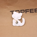Detail of white leather cat charm with gold chain and zircon-inlaid metal pendant - White