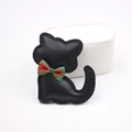 Close-up of black leather cat charm with lychee texture and red-green plaid bow tie - Black