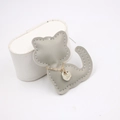 Cute grey cat leather pendant with gold chain and zircon detail on white podium - Gray
