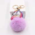 Colorful unicorn keychain with purple faux fur pompom and golden metal lobster clasp - Taro Purple