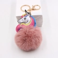 Detail of colorful unicorn pom pom keychain with pink faux fur and golden metal clasp - Dusty Pink