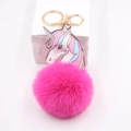 Detail of rose pink unicorn faux fur pom pom keychain with gold lobster clasp - Rose Red