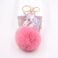 Pink plush unicorn keychain with gold lobster clasp and colorful pattern charm for bags - Peach Pink