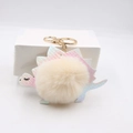 Cute cartoon dinosaur keychain with colorful fish scale texture and fluffy faux fur pompom - Off-white