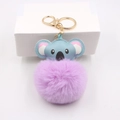 Detail view of light blue koala plush keychain with a soft lavender faux fur pompom ball - Koala Gold Keychain / Taro Purple