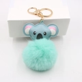 Detail view of cute koala plush keychain with blue leather head and green fur ball - Koala Gold Keychain / Mint Green