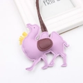 Close-up of light purple PU leather camel pendant with yellow tassel and saddle detail - Taro Purple