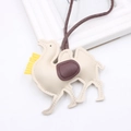 Minimalist beige PU leather camel bag charm with yellow tassel and brown strap detail - Off-white