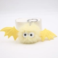 Cute Halloween yellow plush bat keychain with fluffy pompom wings and large eyes - Beige