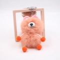 Detail of cute orange plush bear keychain with soft faux fur and metal ring connector - Pink