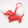 Detailed view of red leather dachshund dog keychain with litchi grain texture - Hanging Organizer Style / Red