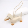 Detail of cream leather dachshund charm showing lychee texture and fine brown stitching - Hanging Organizer Style / Beige
