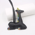 Artistic black leather animal keychain with colorful patchwork on white background - Giraffe