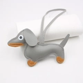 Detail showing grey leather dachshund charm with orange accents and white stitching - Hanging Organizer Style / Gray