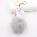 Einhorn Kunstpelz Schlüsselanhänger mit grauem Plüschball und goldenem Karabiner - Goldener Schlüsselanhänger / Hellgrau