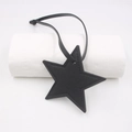 Close-up of black PU leather star pendant with fine stitching and long matching lanyard - Star Lanyard / Black