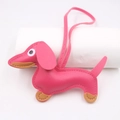 Detail of a pink leather dachshund keychain with fine stitching and a long strap - Hanging Organizer Style / Rose Red