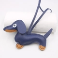 Detailed close-up of dark blue leather dachshund charm with brown accents and litchi texture - Keychain style / Sapphire Blue