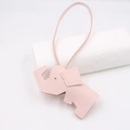 Detailed view of pink elephant bag charm featuring premium lychee grain leather and stitching - Lanyard Elephant Pendant / Pink