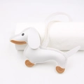 Detail of white litchi pattern leather dachshund charm with brown accents and stitching - Keychain style / White