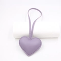 Detail of lavender PU leather heart bag charm with matching top loop and stitching - Purple