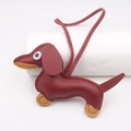 Burgundy and tan leather dachshund dog charm keychain with long tether hanging over white - Hanging Organizer Style / Dark Red