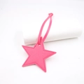 Detail of pink star-shaped PU leather pendant with lychee texture and fine stitching - Star Lanyard / Rose Red