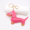 Hot pink leather dachshund dog keychain with golden lobster clasp on a white background - Rose Red Dachshund