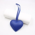 Close-up of royal blue leather heart charm with lychee texture and stitching detail - Sapphire Blue