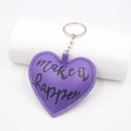 Violetter herzförmiger PU-Leder Schlüsselanhänger mit Make it happen Aufdruck - Lila