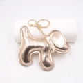 Colgante para bolso de perrito dorado metalizado y llavero de cuero sintético brillante - Llavero de Perro / Oro champán