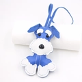 Detail of blue and white leather Schnauzer dog bag charm with stitching and lanyard - Royal Blue