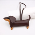 Detail of dachshund leather charm featuring brown lychee grain texture and stitching - New Dachshund Style / Dark Brown