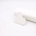Close-up of white heart leather bookmark with detailed machine stitching textures - White