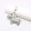 Close-up of a silver leather horse keychain with light green mane and heart saddle detail - Horse Shape Pendant / Silver