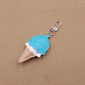 Detailed close-up of a three-color leather ice cream keychain with silver metal clasp - Blue