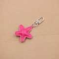 Detail of pink star PU leather keychain with neat stitching and silver lobster clasp accessory - Rose Red