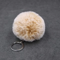 Detailed macro view of fluffy light coffee faux rabbit fur keychain with silver metal ring - Faux Rex Rabbit Fur With Single Ring / Khaki Gradient