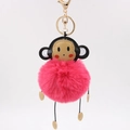 Detail of creative monkey plush keychain with soft pink fur ball and golden metal clasp - 8cm / Rose Red