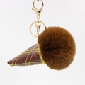 Detail of ice cream keychain with brown faux fur ball and stitched leather cone - Dark Brown