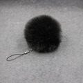 Detail of soft black faux fur pompom keychain with silver lobster clasp and strap - 8cm Faux Fur + Strap / Black