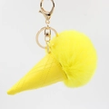 Creative yellow ice cream cone keychain with fluffy pom pom and golden clasp on white background - Yellow