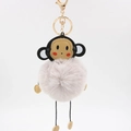 Close-up of a purple faux fur monkey keychain with golden lobster clasp and leather head - 8cm / Light Gray