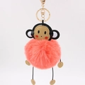 Detailed close-up of a pink faux fur monkey keychain with golden lobster clasp and charms - 8cm / Orange Red