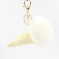 Detailed view of ice cream keychain with fluffy white faux fur and yellow leather cone - Off White
