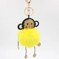 Detail of yellow fluffy monkey plush keychain with golden metal ring and spring hook - 8cm / Yellow