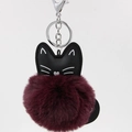 Close-up of black PU leather cat keychain with a soft wine red faux fur pompom ball - 8cm Faux Rabbit Fur / Fuschia