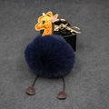 Detailed view of navy plush ball giraffe keychain with golden metal clasp and faux leather - 8cm Faux Rabbit Fur / Navy Blue